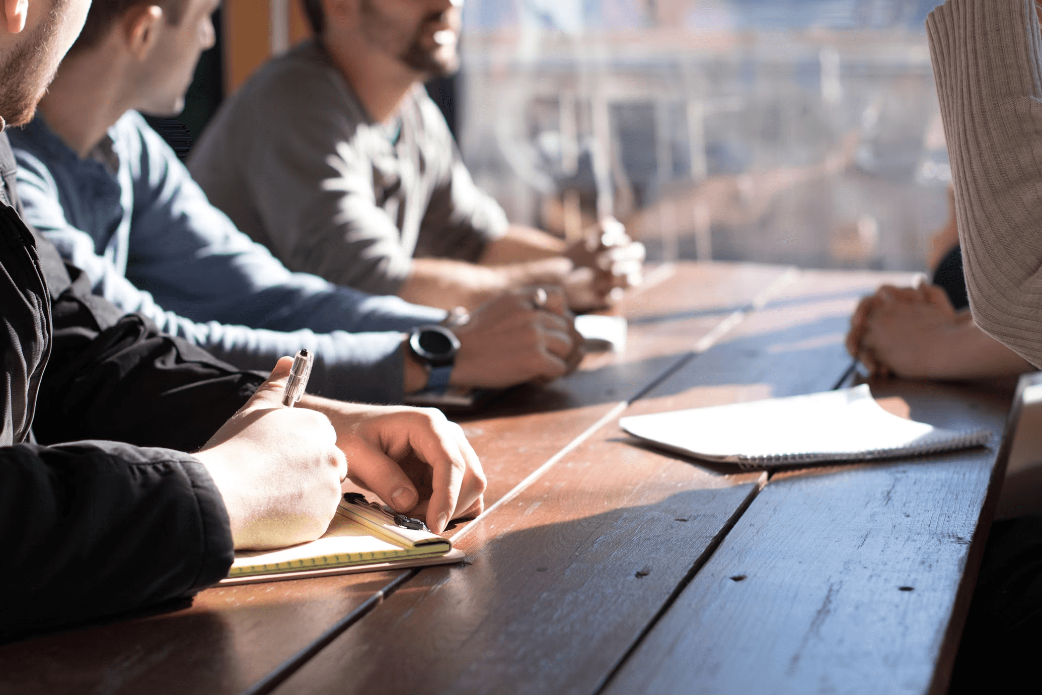 People discussing ideas at a table